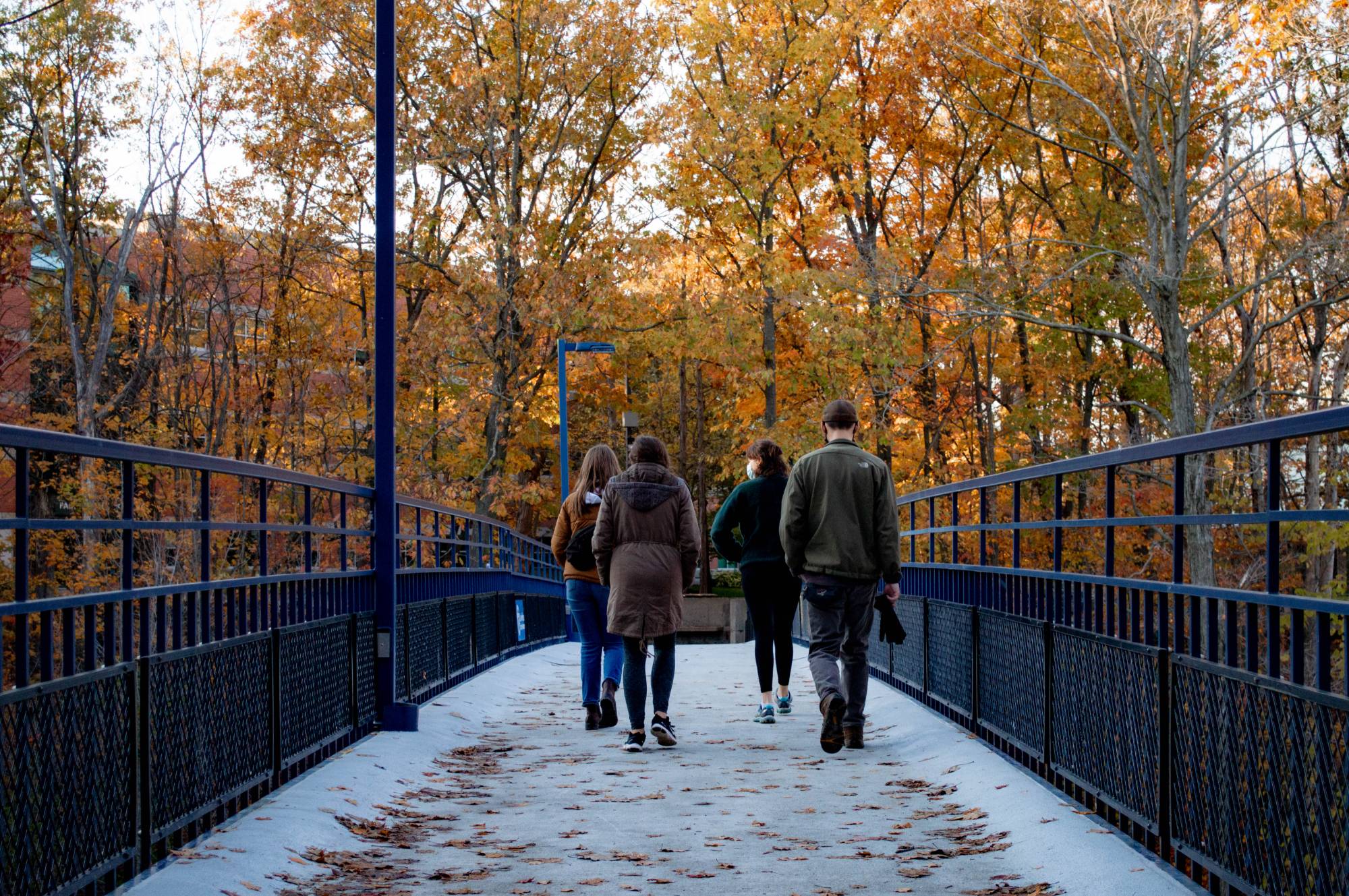 students walking on the little mac bridge